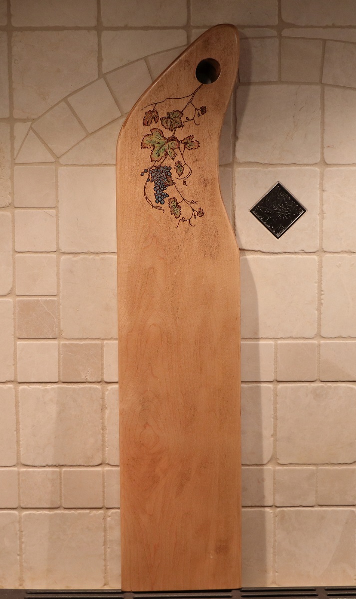 maple charcuterie board with woodburned grapevine plus pencil coloring