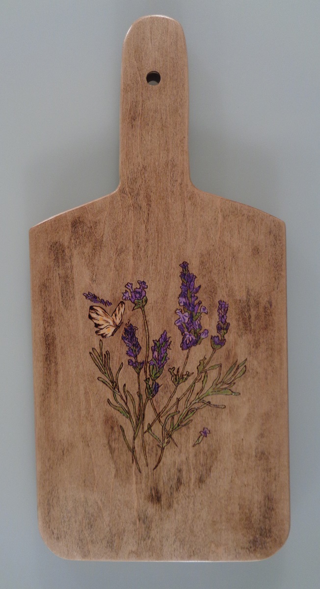 charcuterie board with butterfly and lavendar